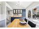 Dining area with natural light and deck access, complemented by stylish navy blue cabinetry at 1292 W 133Rd Cir, Westminster, CO 80234