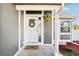 Charming entrance featuring a decorative wreath and floral arrangement at 1292 W 133Rd Cir, Westminster, CO 80234