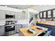 This renovated kitchen offers stainless steel appliances, stylish cabinetry, and a cozy breakfast bar at 1292 W 133Rd Cir, Westminster, CO 80234