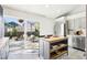 Bright eat-in kitchen area featuring a center island and sliding door access to the deck at 1292 W 133Rd Cir, Westminster, CO 80234