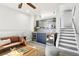 Modern living room area with a fireplace, sleek bar, and easy access to the upper level at 1292 W 133Rd Cir, Westminster, CO 80234