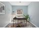 Home office space with a stylish desk, ample natural light, and a calming blue color palette at 1292 W 133Rd Cir, Westminster, CO 80234