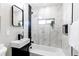 Modern bathroom with marble-look tile and bathtub at 7780 Hollywood St, Commerce City, CO 80022