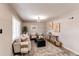 Living room with hardwood floors, neutral walls, and a cozy sitting area at 7780 Hollywood St, Commerce City, CO 80022