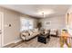 Light and airy living room with beige sofa and coffee table at 7780 Hollywood St, Commerce City, CO 80022