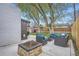 Inviting backyard featuring a fire pit area and comfortable outdoor seating perfect for entertaining guests at 1655 S Lowell Blvd, Denver, CO 80219
