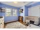 Bright Bedroom featuring hardwood floors, blue walls and a pair of sunny windows for cheerful light at 1655 S Lowell Blvd, Denver, CO 80219