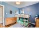 Stylish bedroom featuring wood frame bunk beds, dresser, and plenty of space at 1655 S Lowell Blvd, Denver, CO 80219