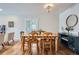 Comfortable dining room with a classic chandelier, hardwood floors and updated design elements at 1655 S Lowell Blvd, Denver, CO 80219
