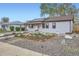 Charming single-story home with modern solar panels and a beautifully landscaped front yard and rock garden at 1655 S Lowell Blvd, Denver, CO 80219