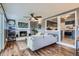 Cozy living room featuring a white brick fireplace and an open view to the kitchen at 1655 S Lowell Blvd, Denver, CO 80219