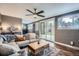Stylish living room with a large sliding glass door leading to a private backyard at 1655 S Lowell Blvd, Denver, CO 80219