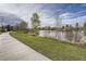 Scenic walking path by the lake surrounded by lush greenery and clear skies at 1655 S Lowell Blvd, Denver, CO 80219