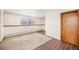 Spacious basement room with tile and carpet flooring at 4730 Carr St, Wheat Ridge, CO 80033