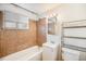 Clean bathroom with tile and a shower/tub combo at 4730 Carr St, Wheat Ridge, CO 80033