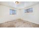 Well-lit bedroom featuring neutral walls and carpet at 4730 Carr St, Wheat Ridge, CO 80033