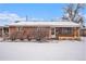 Brick ranch house exterior in winter at 4730 Carr St, Wheat Ridge, CO 80033