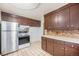 Simple kitchen with dark cabinets and appliances at 4730 Carr St, Wheat Ridge, CO 80033