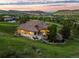 Stunning aerial view of home with beautiful landscaping and outdoor entertaining spaces at 12963 Silver Elk Ln, Littleton, CO 80127