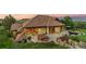 Beautiful backyard featuring a patio with a fire pit and hot tub with scenic views at 12963 Silver Elk Ln, Littleton, CO 80127