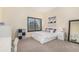 Comfortable bedroom with a cozy bed, window, and furnishings for storage and relaxation at 12963 Silver Elk Ln, Littleton, CO 80127