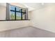 Bright and airy bedroom featuring a large window with scenic views and natural light at 12963 Silver Elk Ln, Littleton, CO 80127