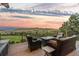 Outdoor deck features comfortable seating around a fire pit with stunning mountain views at 12963 Silver Elk Ln, Littleton, CO 80127