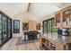 Bright dining area with natural light, stylish rug, and views to the outside at 12963 Silver Elk Ln, Littleton, CO 80127