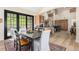 Open dining area with sliding door to the exterior and wood floors at 12963 Silver Elk Ln, Littleton, CO 80127