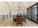 Spacious dining area with a large table, seating for ten, and sliding doors to a patio with a view at 12963 Silver Elk Ln, Littleton, CO 80127