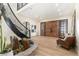 Elegant foyer with statement staircase and water feature at 12963 Silver Elk Ln, Littleton, CO 80127