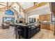 Open concept kitchen with a large center island, views to the living room, and ample cabinet space at 12963 Silver Elk Ln, Littleton, CO 80127
