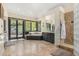 Large primary bathroom with a soaking tub, step-in glass block shower, and a picture window with views at 12963 Silver Elk Ln, Littleton, CO 80127