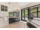 Large primary bathroom with a soaking tub, double vanity, and a picture window with views at 12963 Silver Elk Ln, Littleton, CO 80127