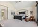 Spacious main bedroom featuring an archway, lounge chair, and large windows at 12963 Silver Elk Ln, Littleton, CO 80127