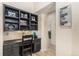 Home office space with custom shelving, granite counters, and storage at 12963 Silver Elk Ln, Littleton, CO 80127