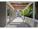 Outdoor deck featuring modern pergola and access to the interior of the home at 16376 Stonefeld Pl, Parker, CO 80134