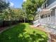 Beautifully landscaped backyard with lush lawn, patio, and privacy fence at 16376 Stonefeld Pl, Parker, CO 80134