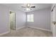 Light-filled bedroom with neutral carpet, a window, and fresh paint at 16376 Stonefeld Pl, Parker, CO 80134