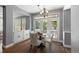 Cozy dining area with a chandelier is adjacent to a built-in and patio access at 16376 Stonefeld Pl, Parker, CO 80134