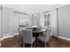 Elegant dining room with hardwood floors, a chandelier, and a round table with six chairs at 16376 Stonefeld Pl, Parker, CO 80134