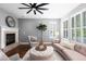 This traditional living room includes a fireplace and plush furniture for comfortable living at 16376 Stonefeld Pl, Parker, CO 80134
