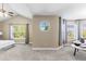 Main bedroom with a seating area and large windows offering natural light and outdoor views at 16376 Stonefeld Pl, Parker, CO 80134