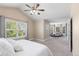 Spacious main bedroom with a sitting area, large windows, and neutral carpeting at 16376 Stonefeld Pl, Parker, CO 80134