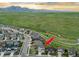 Aerial view of a home in a well-planned community with a large field in the background at 17335 W 94Th Ave, Arvada, CO 80007