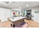 Spacious finished basement featuring a seating area, workspace, and a fun air hockey table at 17335 W 94Th Ave, Arvada, CO 80007