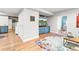 Basement living space featuring a bar area, built in entertainment center, and an adjacent bedroom at 17335 W 94Th Ave, Arvada, CO 80007