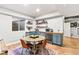 Charming dining area features a bar area with blue cabinets, perfect for entertaining at 17335 W 94Th Ave, Arvada, CO 80007