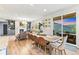 Dining room with wood table, leather chairs, and sliding glass doors to the patio at 17335 W 94Th Ave, Arvada, CO 80007