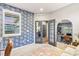Bright home office with statement wallpaper, large windows, and easy access to other rooms in the house at 17335 W 94Th Ave, Arvada, CO 80007